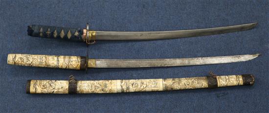 An early 20th century Japanese bone wakizashi and another